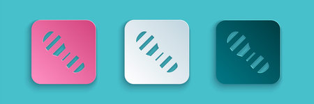 Paper cut Human footprints shoes icon isolated on blue background. Shoes sole. Paper art style....