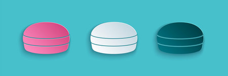 Paper cut Macaron cookie icon isolated on blue background. Macaroon sweet bakery. Paper art style....