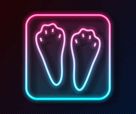 Glowing neon line Rabbit and hare paw footprint icon isolated on black background. Vectorのイラスト素材