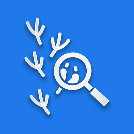 Paper cut Bird footprint under magnifying glass icon isolated on blue background. Animal foot. Paper art style. Vectorのイラスト素材