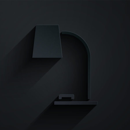 Paper cut Table lamp icon isolated on black background. Table office lamp. Paper art style. Vector Illustrationのイラスト素材