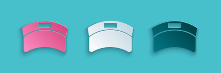 Paper cut Sun visor cap icon isolated on blue background. Sport equipment. Sports uniform. Paper art...