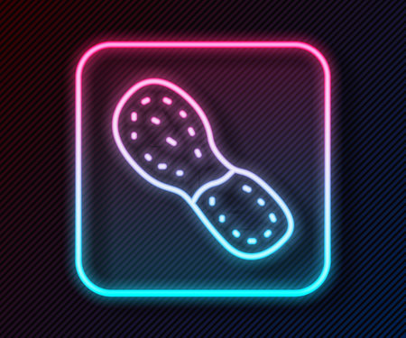 Glowing neon line Human footprints shoes icon isolated on black background. Shoes sole. Vectorのイラスト素材