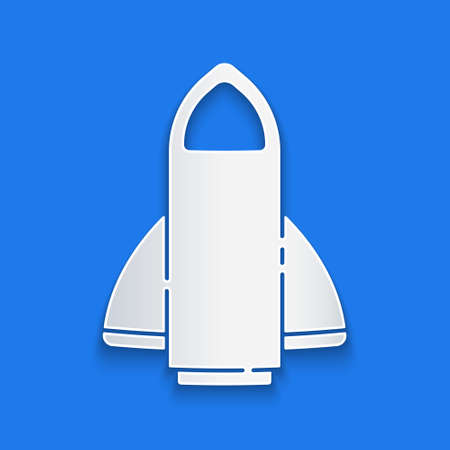 Paper cut Rocket ship icon isolated on blue background. Space travel. Paper art style. Vectorのイラスト素材