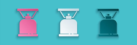 Paper cut Camping gas stove icon isolated on blue background. Portable gas burner. Hiking, camping...