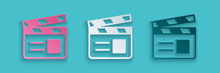Paper cut Movie clapper icon isolated on blue background. Film clapper board. Clapperboard sign....
