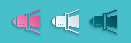 Paper cut Movie spotlight icon isolated on blue background. Light Effect. Scene, Studio, Show. Paper...