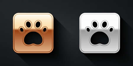 Gold and silver Paw print icon isolated on black background. Dog or cat paw print. Animal track. Long shadow style. Vectorのイラスト素材