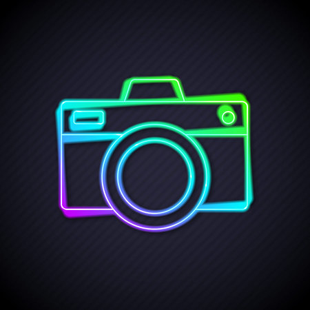 Glowing neon line Photo camera icon isolated on black background. Foto camera icon. Vectorのイラスト素材