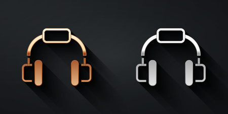 Gold and silver Headphones icon isolated on black background. Earphones. Concept for listening to music, service, communication and operator. Long shadow style. Vectorのイラスト素材