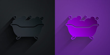 Paper cut Bathtub with foam bubbles inside icon isolated on black on purple background. Paper art style. Vectorのイラスト素材