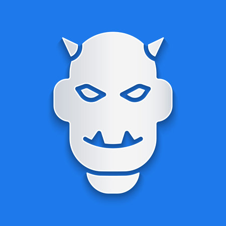 Paper cut Mask of the devil with horns icon isolated on blue background. Paper art style. Vector