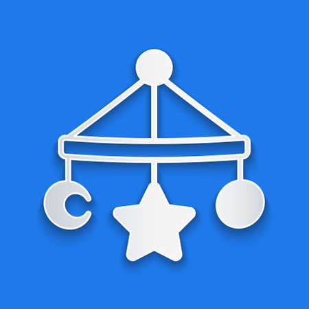 Paper cut Baby crib hanging toys icon isolated on blue background. Baby bed carousel. Paper art style. Vectorのイラスト素材