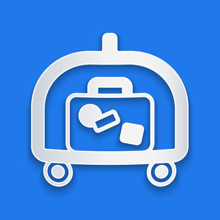 Paper cut Hotel luggage cart with suitcase icon isolated on blue background. Traveling baggage sign. Travel luggage icon. Paper art style. Vectorのイラスト素材