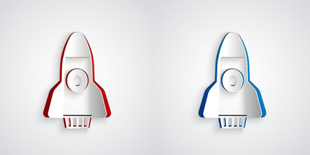 Paper cut Rocket ship icon isolated on grey background. Space travel. Paper art style. Vectorのイラスト素材
