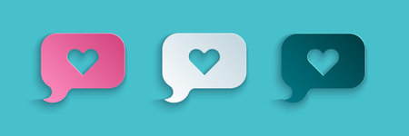 Paper cut Heart in speech bubble icon isolated on blue background. Happy Valentines day. Paper art...