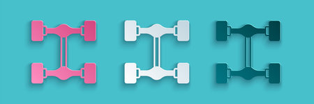 Paper cut Chassis car icon isolated on blue background. Paper art style. Vector