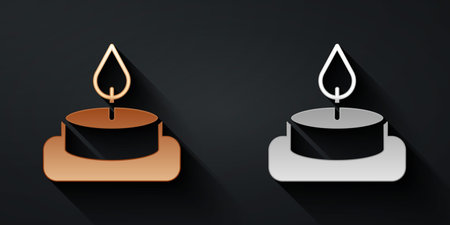 Gold and silver Aroma candle icon isolated on black background. Long shadow style. Vectorのイラスト素材