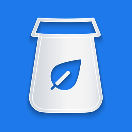 Paper cut Tea packaging icon isolated on blue background. Paper bag with tea. Paper art style. Vectorのイラスト素材