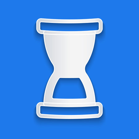 Paper cut Old hourglass with flowing sand icon isolated on blue background. Sand clock sign....