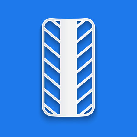 Paper cut Car tire wheel icon isolated on blue background. Paper art style. Vectorのイラスト素材
