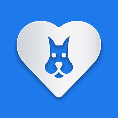 Paper cut Heart with dog icon isolated on blue background. Pet paw in heart. Love to the animals. Paper art style. Vectorのイラスト素材