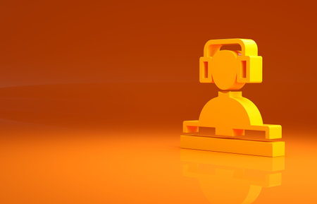 Yellow DJ wearing headphones in front of record decks icon isolated on orange background. DJ playing...