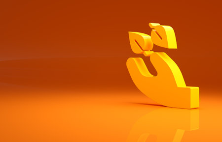 Yellow Tea leaf in hand icon isolated on orange background. Tea leaves. Minimalism concept. 3d illustration 3D renderの写真素材