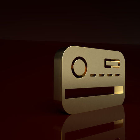 Gold Credit card icon isolated on brown background. Online payment. Cash withdrawal. Financial operations. Shopping sign. Minimalism concept. 3D render illustrationの写真素材