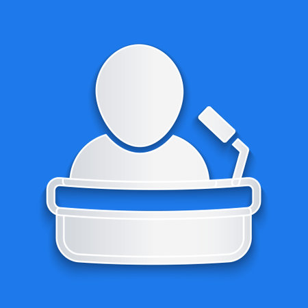 Paper cut Speaker icon isolated on blue background. Orator speaking from tribune. Public speech. Person on podium. Paper art style. Vectorのイラスト素材
