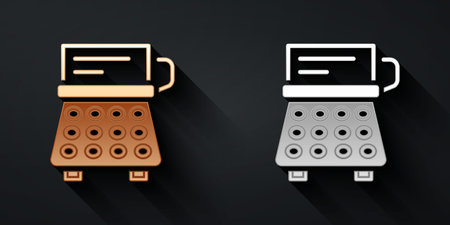 Gold and silver Retro typewriter and paper sheet icon isolated on black background. Long shadow style. Vectorのイラスト素材