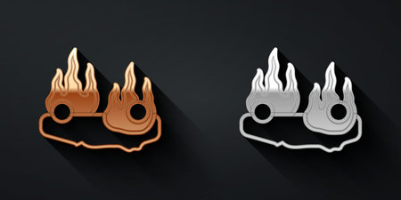 Gold and silver Burning car icon isolated on black background. Car on fire. Broken auto covered with fire and smoke. Long shadow style. Vectorのイラスト素材