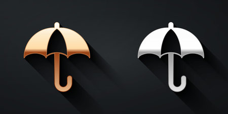 Gold and silver Classic elegant opened umbrella icon isolated on black background. Rain protection symbol. Long shadow style. Vectorのイラスト素材