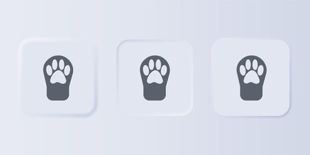Gray Paw print icon isolated on gray background. Dog or cat paw print. Animal track. Set icons in square buttons. Vector.のイラスト素材