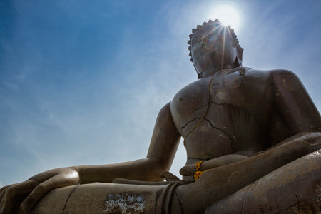 Big buddha with bright sun light shine from the head.の写真素材