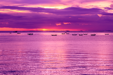 Seascape view with boats and dramatic evening sky.の写真素材