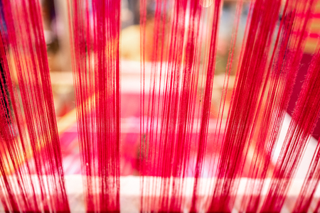 Abstract background of thread on bobbin prepared for weaving and making clothes.の写真素材