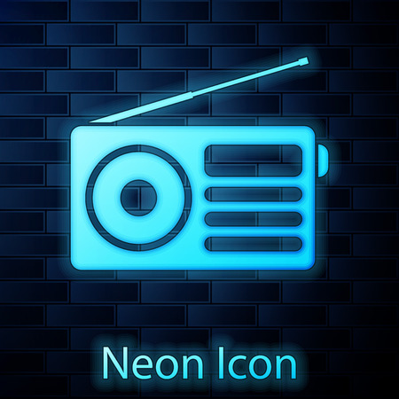 Glowing neon Radio with antenna icon isolated on brick wall background. Vector Illustrationのイラスト素材
