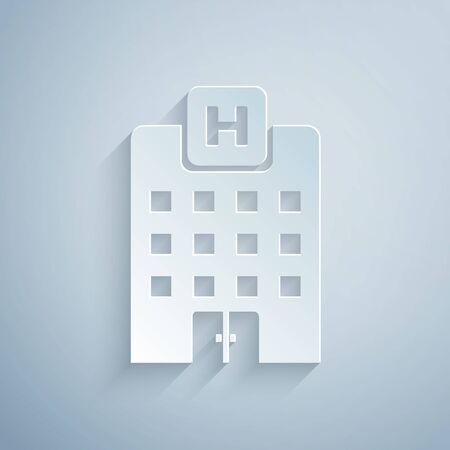 Paper cut Medical hospital building with cross icon isolated on grey background. Medical center. Health care. Paper art style. Vector Illustrationのイラスト素材