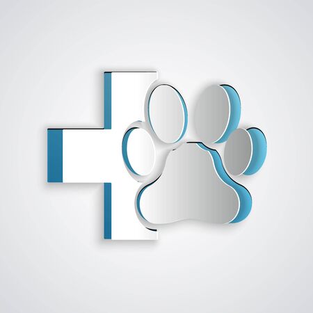 Paper cut Veterinary clinic symbol icon isolated on grey background. Cross hospital sign. A stylized paw print dog or cat. Pet First Aid sign. Paper art style. Vector Illustrationのイラスト素材