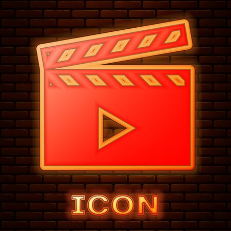 Glowing neon Movie clapper icon isolated on brick wall background. Film clapper board. Clapperboard sign. Cinema production or media industry concept. Vector Illustrationのイラスト素材