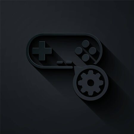 Paper cut Gamepad and gear icon isolated on black background. Adjusting app, service concept, setting options, maintenance, repair, fixing. Paper art style. Vector Illustrationのイラスト素材