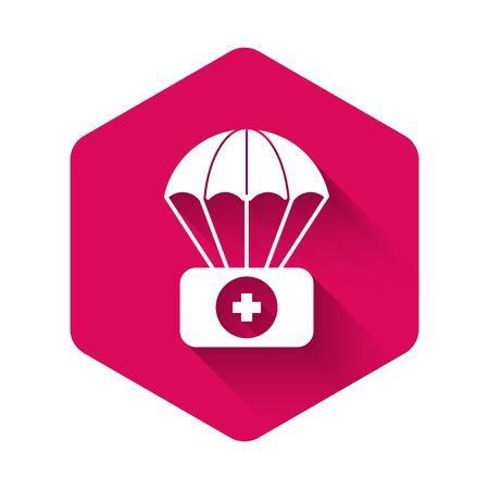 White Parachute with first aid kit icon isolated with long shadow. Medical insurance. Pink hexagon button. Vector Illustrationのイラスト素材