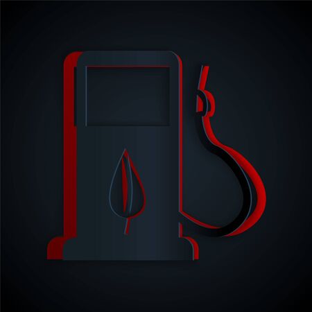 Paper cut Bio fuel concept with fueling nozzle and leaf icon isolated on black background. Gas station with leaves. Eco refueling. Paper art style. Vector Illustrationのイラスト素材