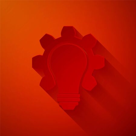 Paper cut Light bulb and gear icon isolated on red background. Innovation concept. Business idea. Paper art style. Vector Illustrationのイラスト素材