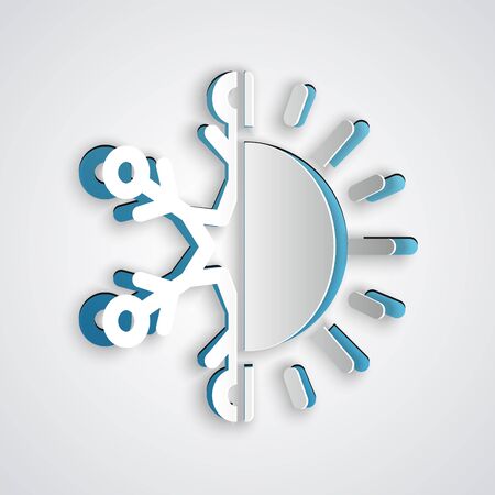 Paper cut Hot and cold symbol. Sun and snowflake icon isolated on grey background. Winter and summer symbol. Paper art style. Vector Illustrationのイラスト素材