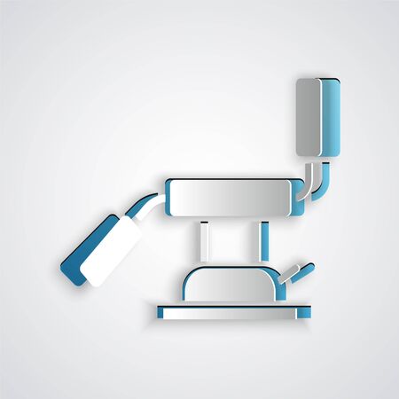 Paper cut Medical dental chair icon isolated on grey background. Dentist chair. Paper art style. Vector Illustrationのイラスト素材