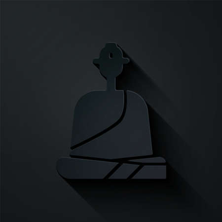 Paper cut Buddhist monk in robes sitting in meditation icon isolated on black background. Paper art style. Vector Illustration.のイラスト素材