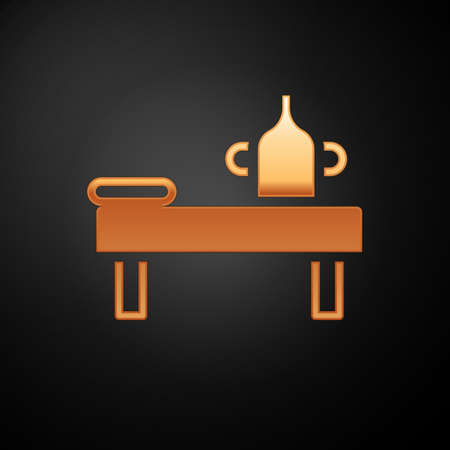Gold Massage table with oil icon isolated on black background. Vectorのイラスト素材