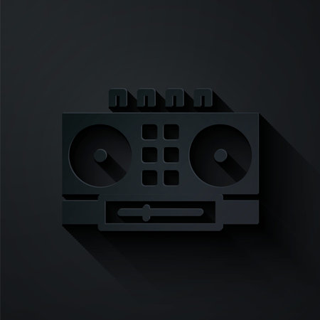 Paper cut DJ remote for playing and mixing music icon isolated on black background. DJ mixer complete with vinyl player and remote control. Paper art style. Vectorのイラスト素材